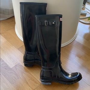 Tall black hunter boots